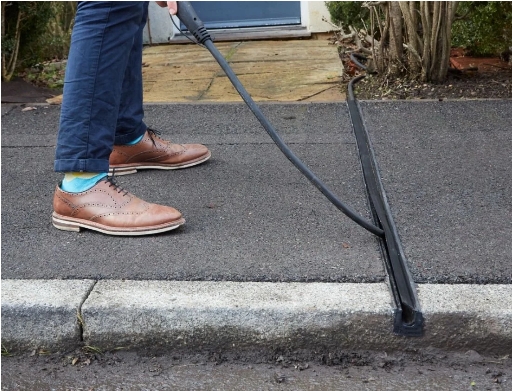 Photo of Kerbside EV Charging Gully with Charging Cable being Installed or Removed