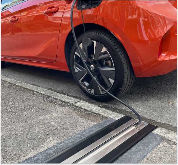Photo of Cross Pavement EV Charging Gully with Charging Cable Inserted into Car